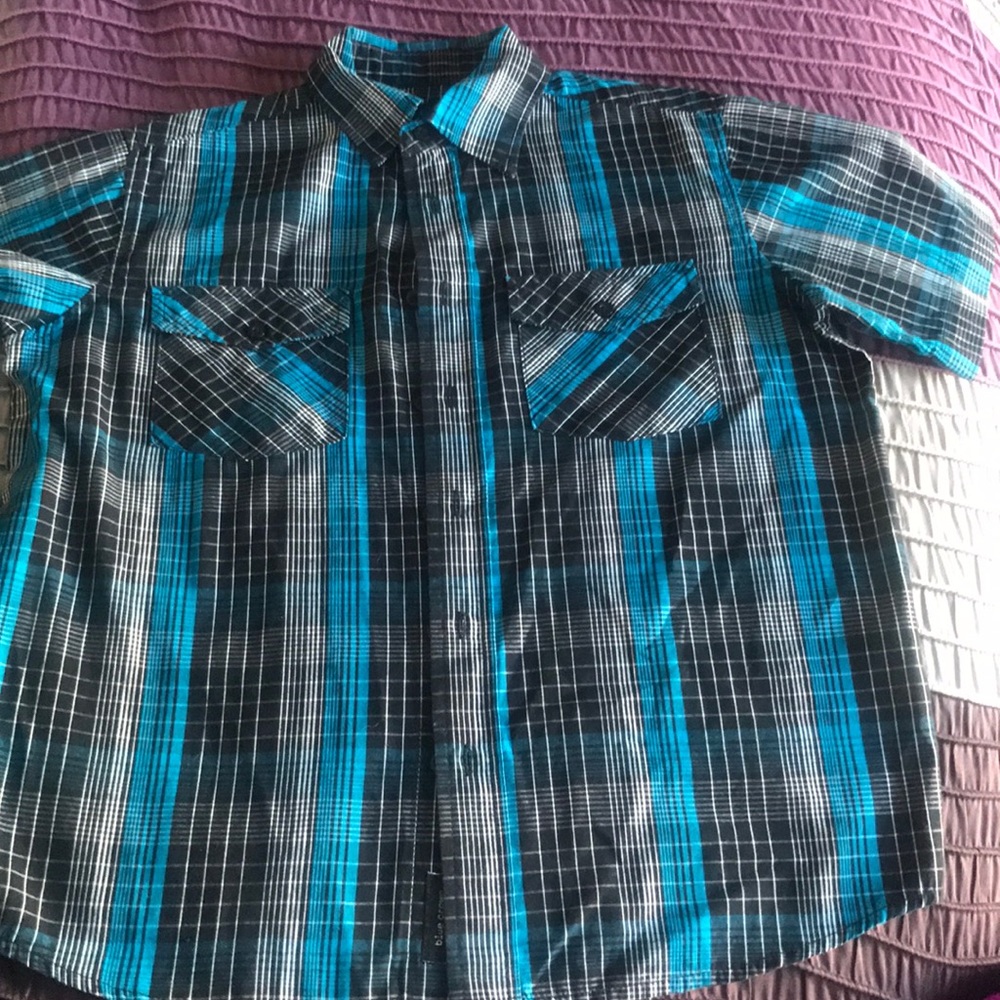 Blue button down shirt.